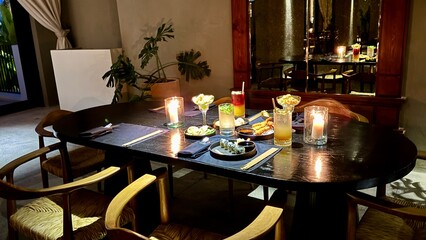Close-up of a person using chopsticks to pick japanese food at sushi bar Sushi sashimi set Spicy tuna sushi roll topped with crispy flakes and drizzled with sauce