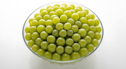 Abundance of Fresh Green Grapes in a Clear Glass Bowl on White Background