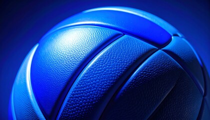 Close up of a blue volleyball with dramatic lighting.