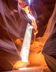 Sunlight shaft in sandstone canyon