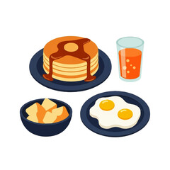A delicious breakfast spread featuring fluffy pancakes, fried eggs, and orange juice.