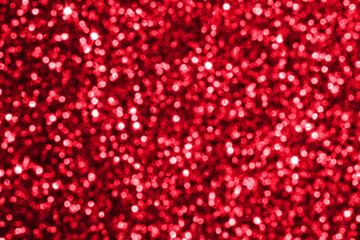 Abstract red Christmas glitter sparkle texture with bokeh background