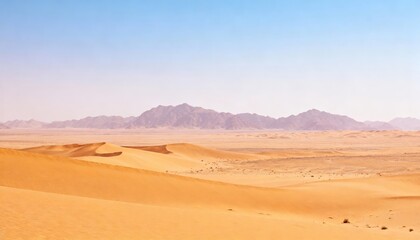 Desert landscape with sand dunes and mountains under a blue sky.