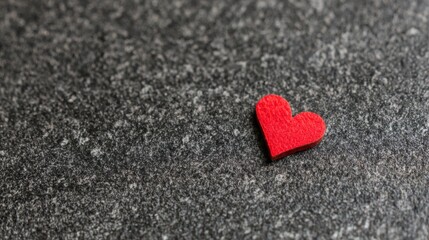 Fototapeta premium affection. A glowing red heart shape floats against a dark textured background with warm edges and soft lighting. wellbeing guides.