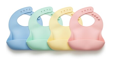 Four Pastel Color Silicone Baby Bibs Arranged in a Row Isolated on White Background
