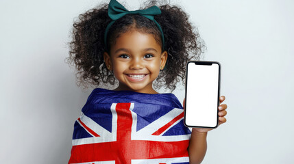 A little black girl holds a mobile phone with a white screen in her hand. She is wrapped in the Australian flag. A phone mockup for advertising Australian goods and services