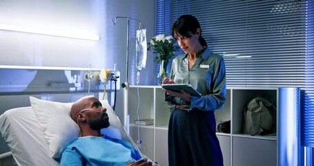 Doctor, woman and tablet for results in hospital with patient for healthcare or consultation. Research, support and service with tech for diagnosis, medical treatment and discussion in night clinic