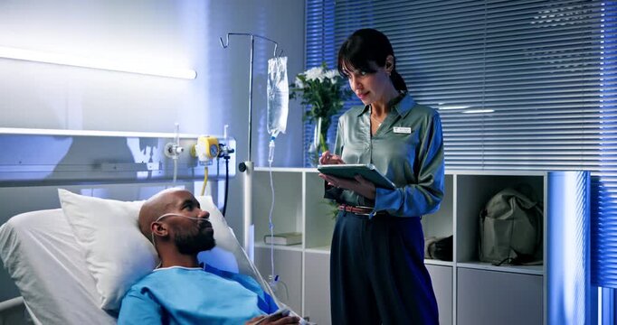 Doctor, woman and tablet for results in hospital with patient for healthcare or consultation. Research, support and service with tech for diagnosis, medical treatment and discussion in night clinic - Powered by Adobe