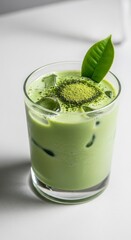 Green Matcha Latte Drink With Ice Cubes and Leaf on a White Background Studio Shot