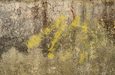 Grunge old wall texture with yellow paint stains and weathered surface