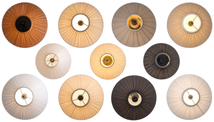 Overhead shot showcasing varied lamp shades. Pleated fabric, circular designs, and warm lights. Diverse colors