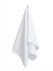 Fototapeta premium A folded white towel hangs against a plain background. The towel is soft and clean, suitable for bathroom or kitchen use.