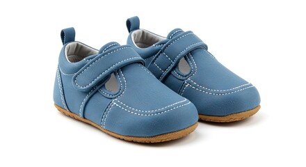 Two blue baby shoes with brown soles and white stitching sit side by side on a white background