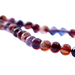 Close-up of a beaded necklace, swirling colors