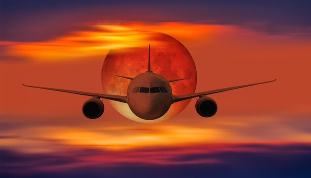 Passenger airplane flying over sea with lunar eclipse at sunset"Elements of this image furnished by NASA " - Powered by Adobe