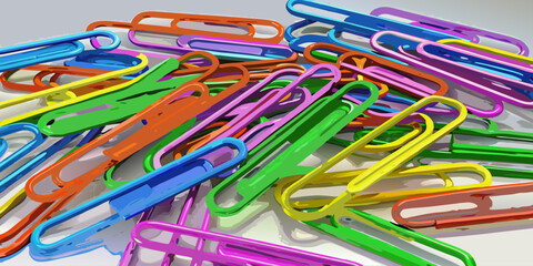 Colorful paperclips scattered randomly on a white background, showcasing a variety of bright hues and overlapping arrangements.