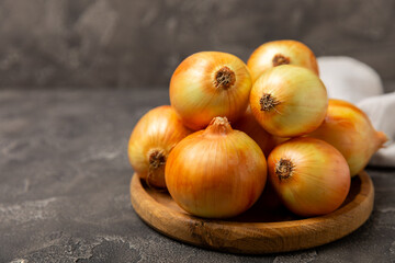 Onion on the kitchen table. onion slice. onion rings. Fresh Yellow Onion. Natural, fresh, vegetarian food. Agricultural products. Healthy eating. Vegetables. Farmer's market. Space for text.Copy space