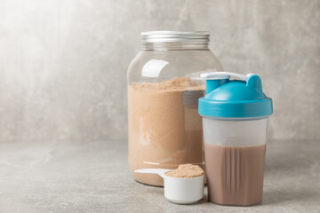 Protein powder. protein shake. Shaker bottle with protein. Food supplement. Whey protein powder with shaker for mixing. Sports nutrition. Concept of sports and healthy lifestyle. Sports equipment