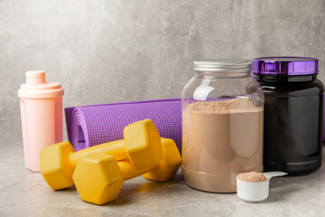 Protein powder. protein shake. Shaker bottle with protein. Food supplement. Whey protein powder with shaker for mixing. Sports nutrition. Concept of sports and healthy lifestyle. Sports equipment