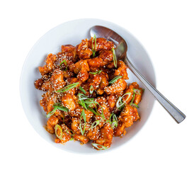 korean popcorn chicken with silver spoon