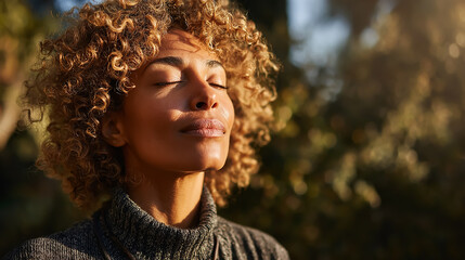 Peaceful African American woman meditating outdoors, eyes closed in serene prayerful pose, soft natural sunlight, calm nature background