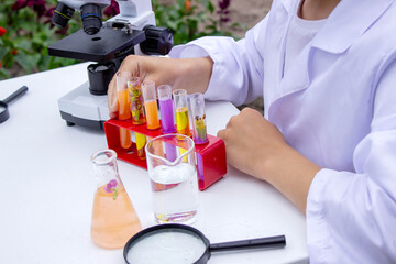 Boy conducting science experiments. Child with microscope