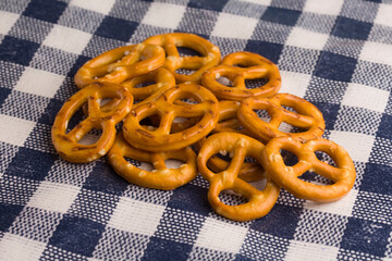 set of german pretzels on a checkered tablecloth

