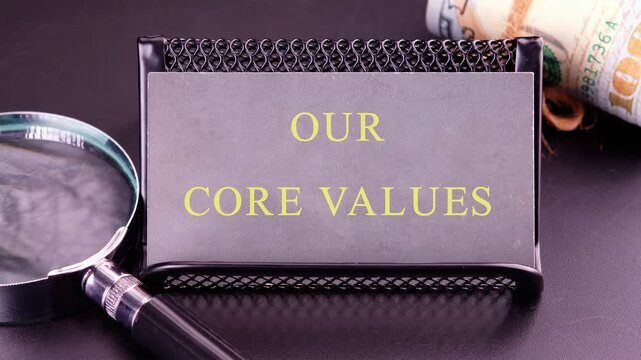 Business value and our core values concept. Animation of the conceptual text of OUR CORE VALUES, on the business card close-up