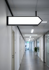Empty white directional sign on a modern office corridor. Modern blank sign mounted on a hallway wall with numerous doors.