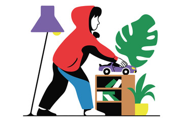 Fototapeta premium Young child in red hoodie plays with toy car on bookshelf in cozy room