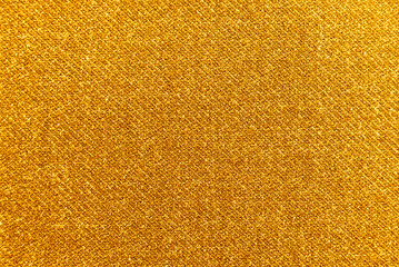 Texture of dense yellow fabric for tailoring. Canvas. Textile. Material