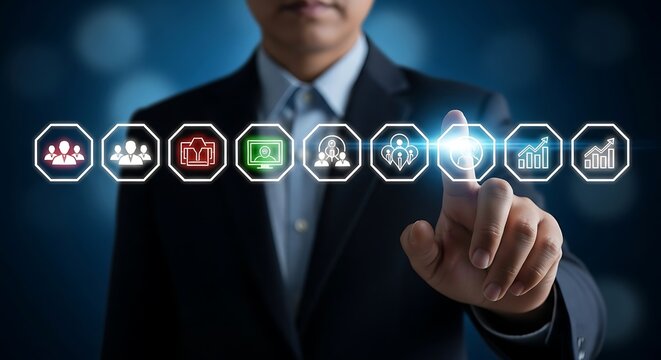 Businessman pointing at a row of digital icons representing business processes finger touch