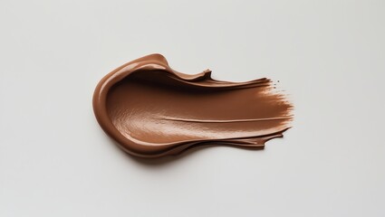Smudge of brown cosmetic texture beautifully presented on white background
