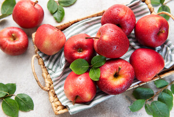 Fresh red apples resting in a basket, a symbol of healthy eating