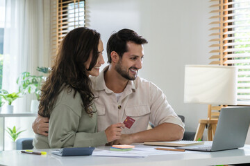 Couple using credit card pay the bill online shopping, making payment and browsing modern platform.