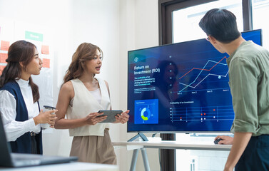 team of financial discussion business planning, analyzing digital financial data and strategy in a modern office
