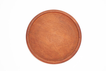 A dark brown circular wooden plate sits on a white background.