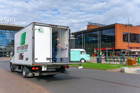 White Petit Forestier refrigerated truck unloading goods in front of Manufaktura shopping center. Logistics, transport, goods delivery, Poland