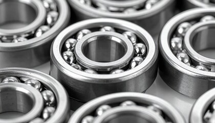 Macro thrust bearing washer set stacked slightly offset satin steel finish clean technical background with copy space for catalog template and engineering layout