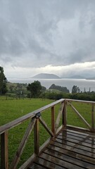 Beautiful view of Lago Ranco in Chile on a cloudy day, with calm waters, mountains, and forested shores creating a peaceful natural landscape.