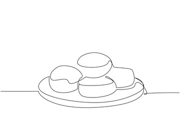 Single continuous line drawing buttermilk biscuits on a round wooden cutting board. A delicious warm meal. Good nutrition for body. National Buttermilk Biscuit Day. One line design vector illustration