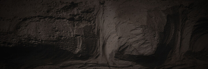 Masonry texture. The rough surface of the stones is plastered and painted. Dark wide panoramic...