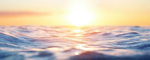 Sunrise over tranquil ocean waves