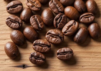 Naklejka premium Closeup shot of roasted coffee beans scattered on a wooden surface, highlighting their rich texture and aroma, perfect for beverage and culinary themes