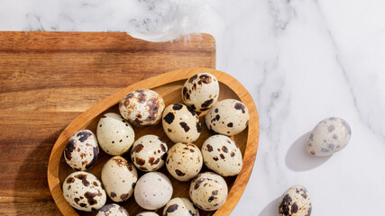 Quail eggs in rustic wooden bowl evoke speckled mysteries of Orion, culinary intrigue for Samhain...