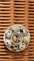 Quail eggs in rustic wabi-sabi dish evoke Easter simplicity and serene Autumn Equinox gatherings in textured harmony