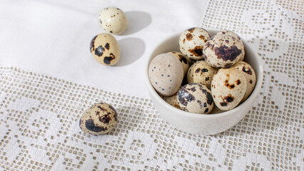 Speckled quail eggs nestled in a porcelain dish, embodying exquisite Easter brunch artistry and ancient fertility festival symbolism