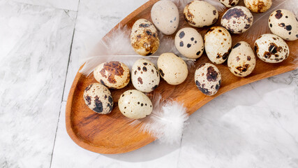 Marbled quail eggs nestled in a wooden bowl, whispering of old-world kitchens and Vernal Equinox brunch rituals