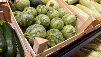 Crate of monochrome round zucchini whispers harvest abundance, harmonizing with World Vegetarian...