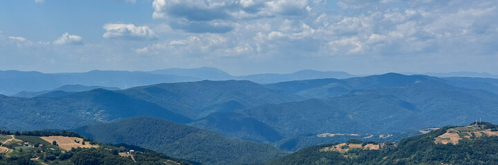 Expansive azure mountain vista, whispering tales of hidden valleys; perfect for Sky Appreciation Day and National Landscapes Week